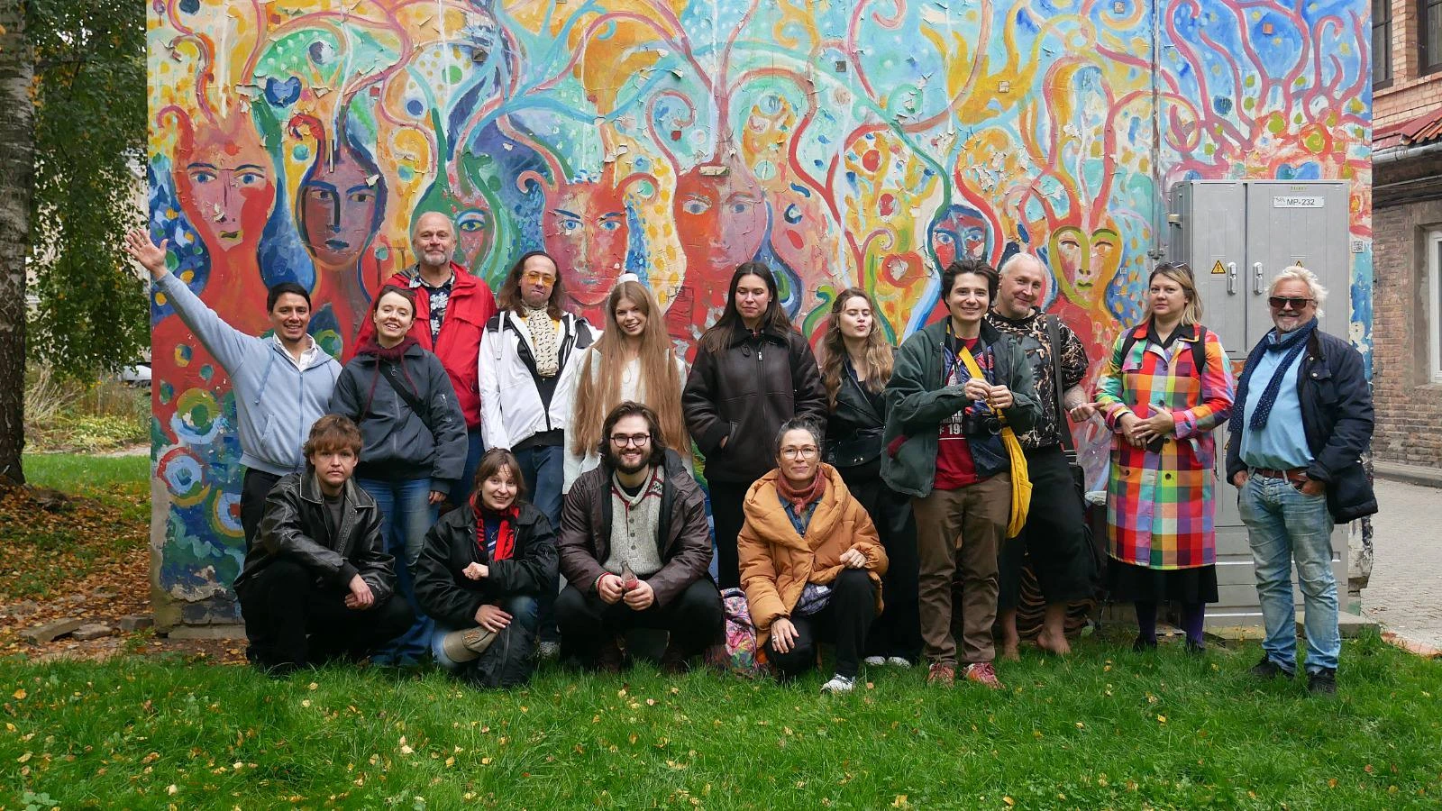 Film Camp group posing in front of a colourful mural