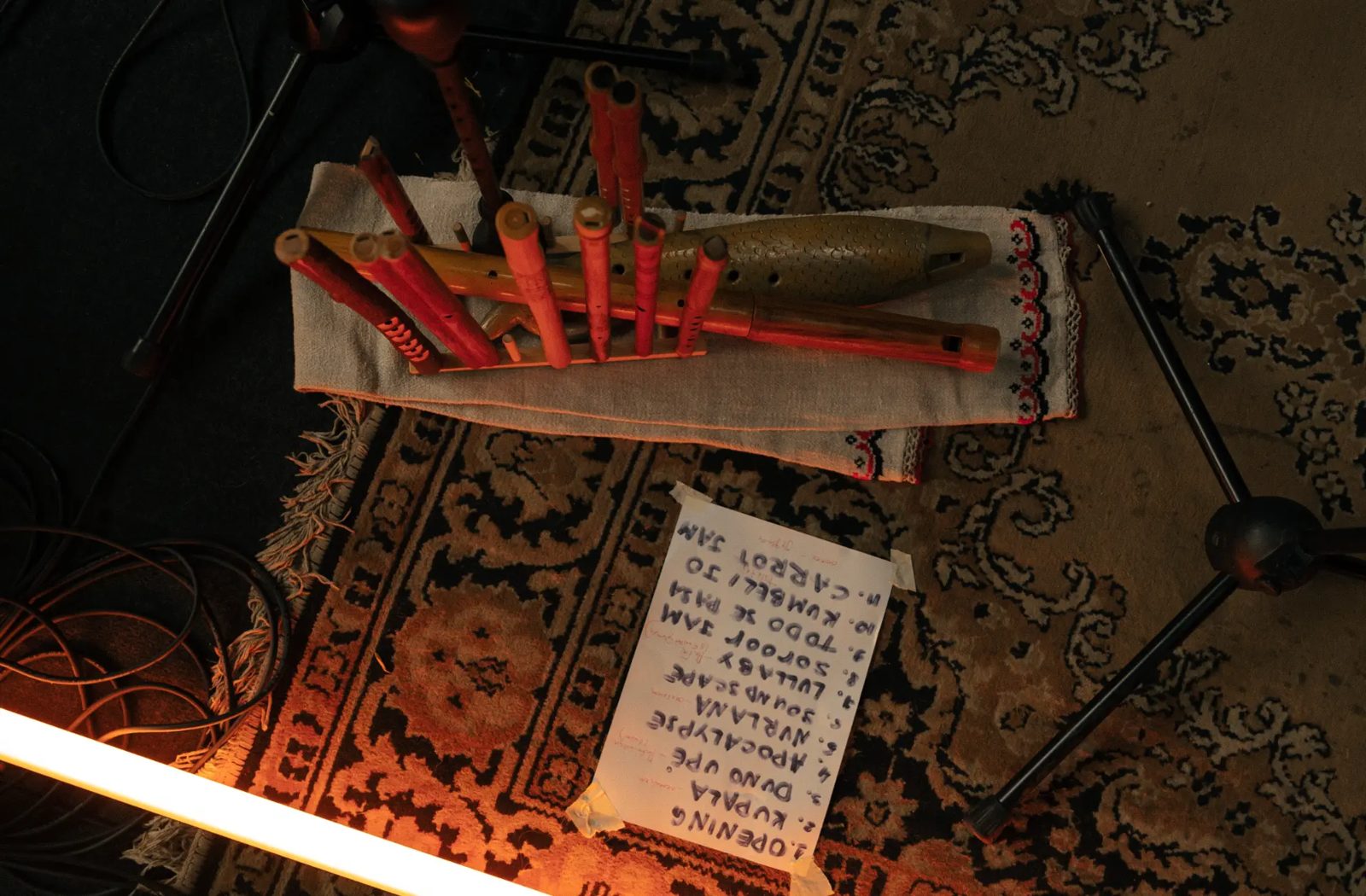 Wind instruments and the concert setlist on a carpet