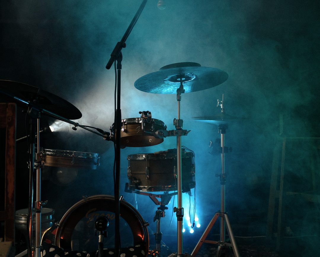 Drum kit on the smoky stage under blue light
